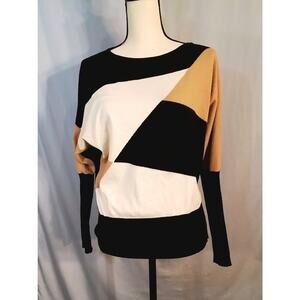 Aaeda; Color block sweater: Black, tan, cream